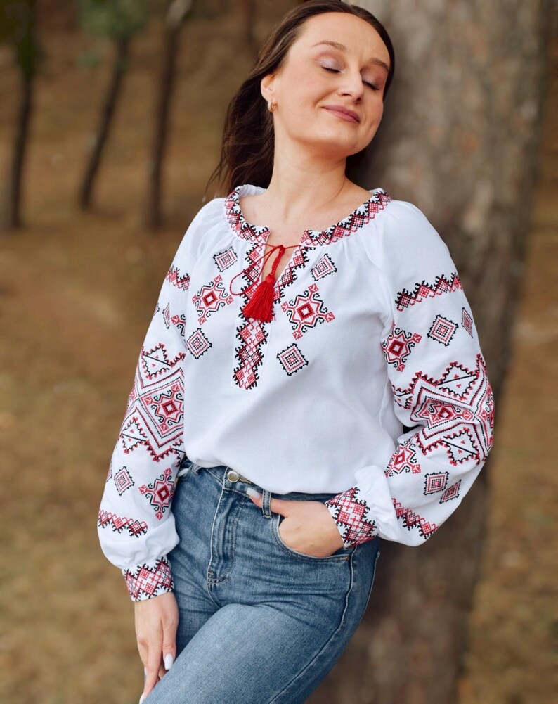 White Folk Embroidered Blouse with Red and Black Geometric Patterns – Long Sleeve Traditional Peasant Shirt for Women with Tassel Tie Detail