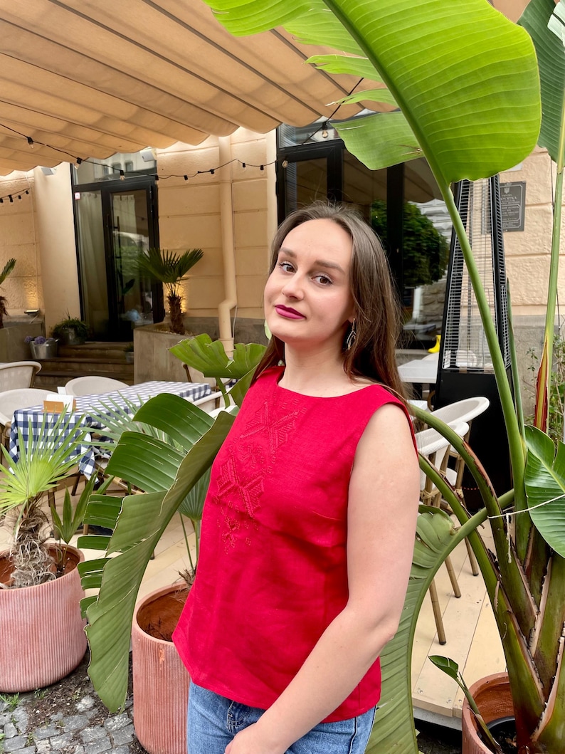 Red linen sleeveless blouse with traditional Ukrainian stitch embroidery
