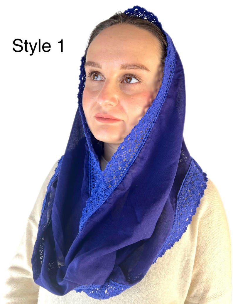 May include: A royal blue head covering with a blue lace trim. The head covering is made of a soft, lightweight fabric. Style 1.