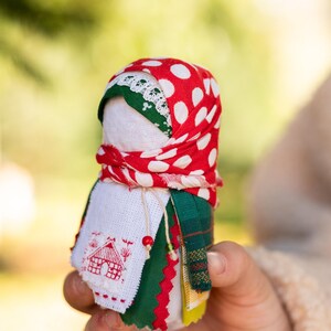 Traditional cloth doll in yellow with floral embroidery