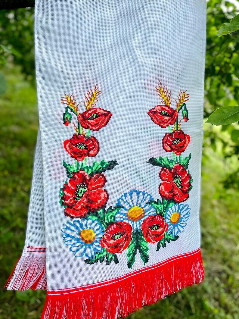 Hand-embroidered table runner with vibrant floral design