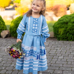 Traditional blue embroidered Ukrainian girl dress with long sleeves and white lace trim, Folk style cotton outfit for special occasions