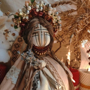 Handmade Ukrainian Motanka doll with floral headpiece
