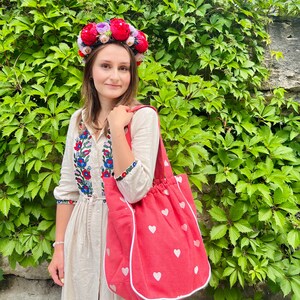 Large beautiful handmade wreath on the head. Made from artificial flowers. Will complement any holiday look. Made in Ukraine.