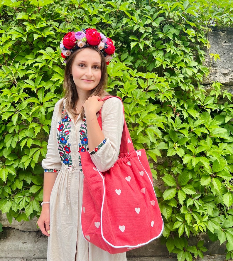 Large beautiful handmade wreath on the head. Made from artificial flowers. Will complement any holiday look. Made in Ukraine.