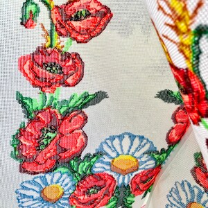 Hand-embroidered table runner with vibrant floral design