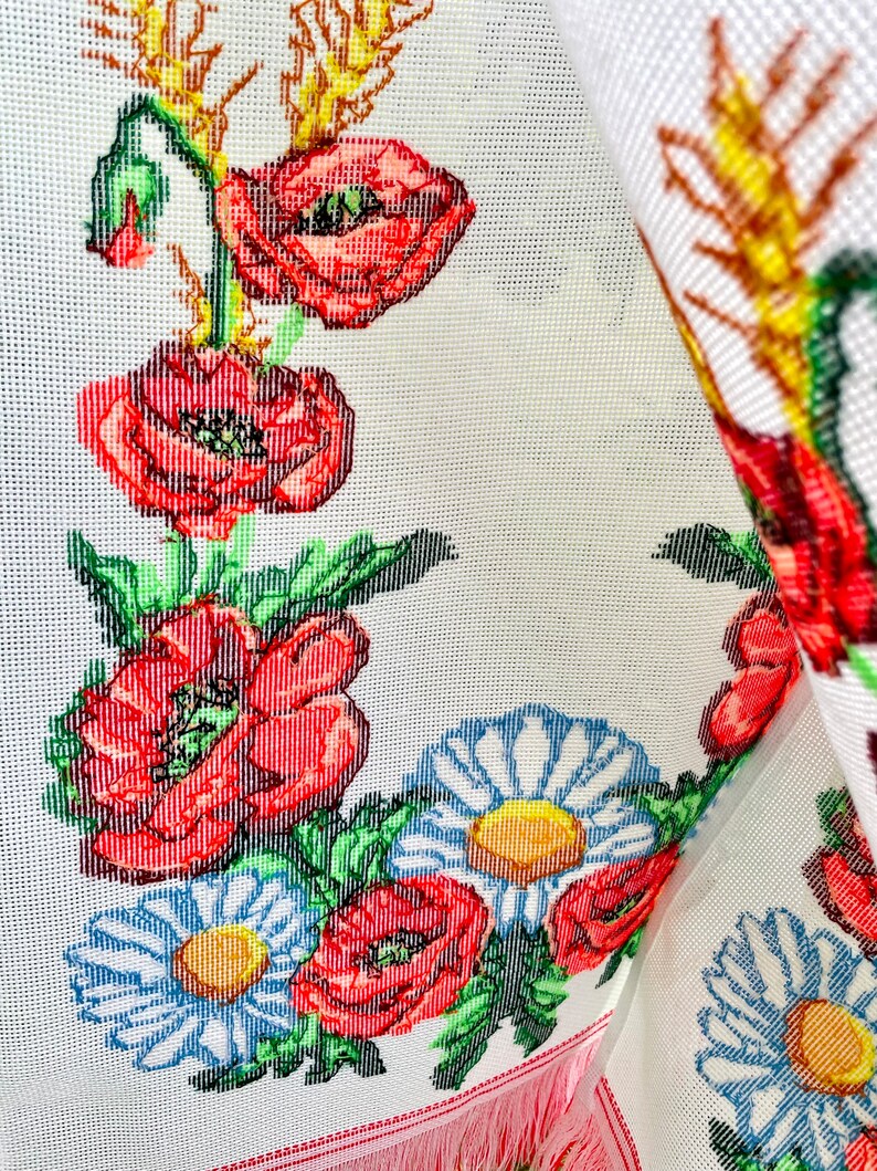 Hand-embroidered table runner with vibrant floral design