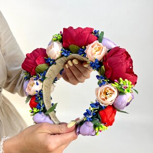 Large beautiful handmade wreath on the head. Made from artificial flowers. Will complement any holiday look. Made in Ukraine.