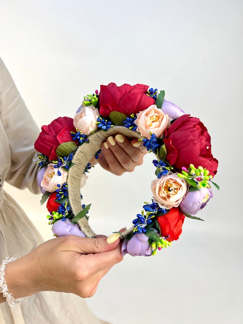 Large beautiful handmade wreath on the head. Made from artificial flowers. Will complement any holiday look. Made in Ukraine.