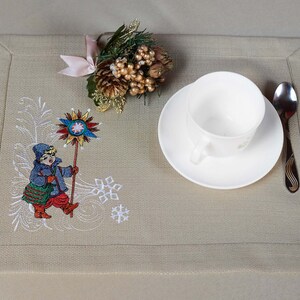 Festive beige cotton napkin with holiday winter scenes