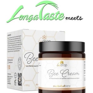Può includere: Un barattolo di "Bee Cream" con coperchio nero ed etichetta bianca, accanto a una scatola bianca con lo stesso marchio. La crema è a base di cera d'api, apitossina e 8 estratti di erbe. Il barattolo contiene 100 g di crema.