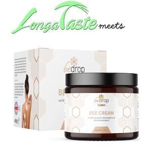 May include: A jar of "bedrop BEE CREAM" with a black lid and a white label featuring a honeycomb design. The product is displayed next to a box with the "bedrop" logo and a woman's silhouette. The text "Longa Taste meets" is at the top.
