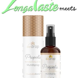 May include: Two bottles of Propolis Manuka Honey & Anise Mouth Spray by bedrop. The bottles are brown glass with a gold label and a bee logo. The text on the label reads "Propolis Manuka Honig & Anis Mundspray #natürlichbiene".