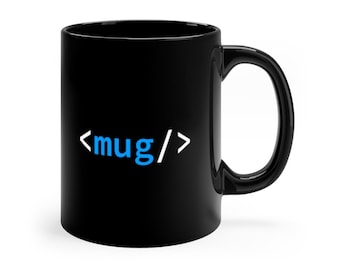 May include: A glossy black ceramic mug featuring a white and light blue graphic print on the front. The design displays the text <mug/>, with the word mug in light blue and the surrounding angle brackets and slash in white, centred on the mug.