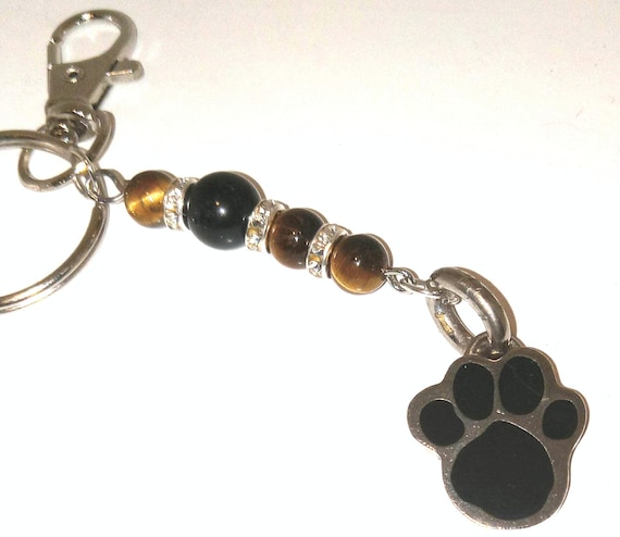 Reinvented Coach Paw print key chain