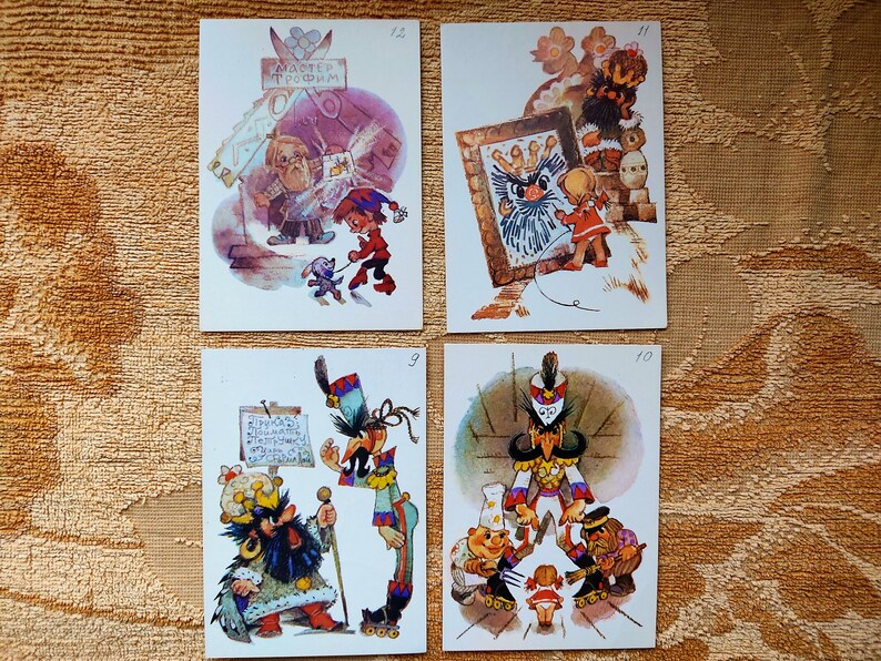 May include: Four vintage postcards featuring illustrations of cartoon characters. The postcards are numbered 9, 10, 11, and 12. The illustrations are colorful and whimsical.