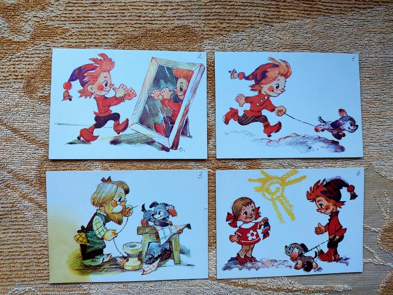 May include: Four vintage postcards featuring a cartoon character with red hair and a red and white outfit. The character is depicted in various scenes, including looking in a mirror, walking a dog, sewing, and playing with a dog.