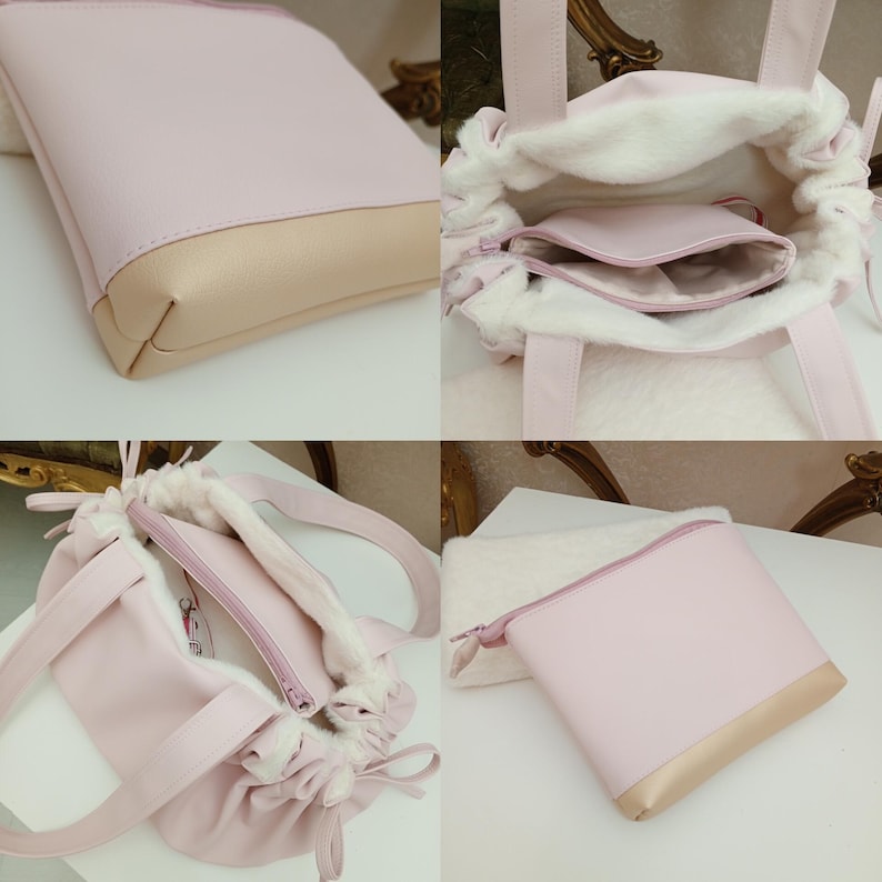 May include: A light pink tote bag with a drawstring closure and a matching small pouch. The bag has a soft, faux fur lining and a light tan bottom. The handles and drawstring are also light pink.