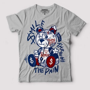 Smile Through The Pain Graphic To Match Jordan 13 French Blue - Light Steel Grey T-Shirt