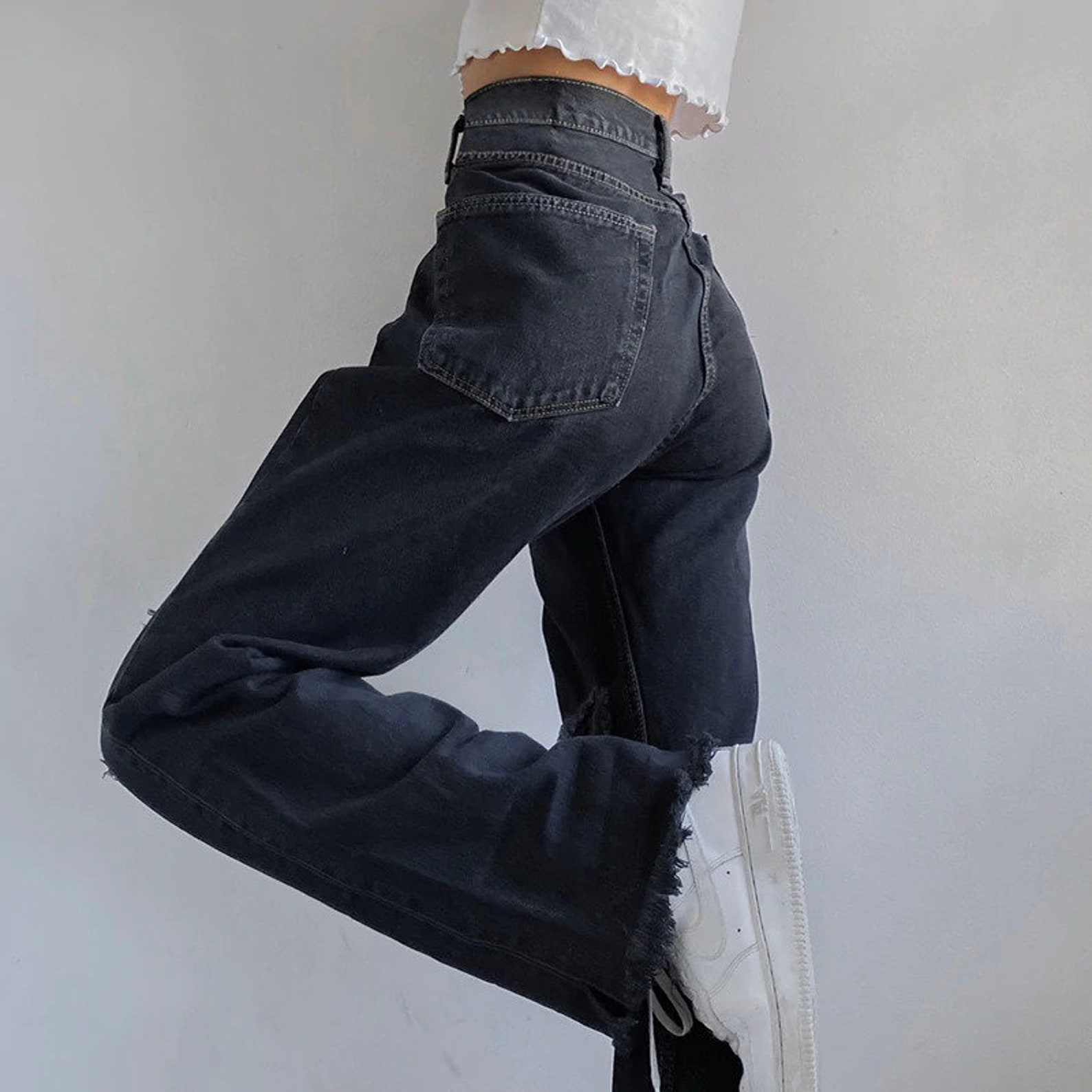 black baggy pants with white stitching