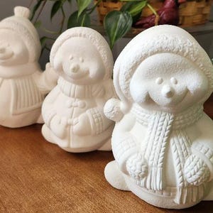Ceramic bisque, ready to paint cute snowman trio. Set of 3 smiling unpainted snowmen. Bisque Clay Magic snowmen to paint.