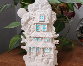 Unpainted ceramic bisque small haunted house ready for you to paint. Cut out windows light up. Halloween ceramics. Halloween bisque