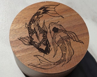 May include: A wooden box lid with a laser-engraved design of two black and white koi fish swimming in opposite directions.