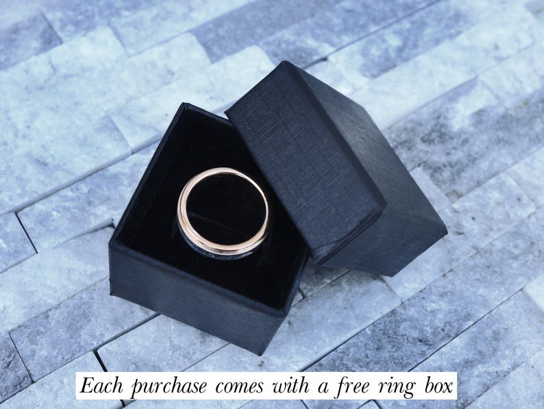 May include: A black ring box with a silver ring inside. Each purchase comes with a free ring box.