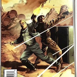 May include: A comic book cover featuring a scene from the Battlestar Galactica Season Zero series. Two characters are shown in a futuristic setting, one holding a gun and the other running. The cover is titled "Battlestar Galactica Season Zero" and features the Dynamite logo.