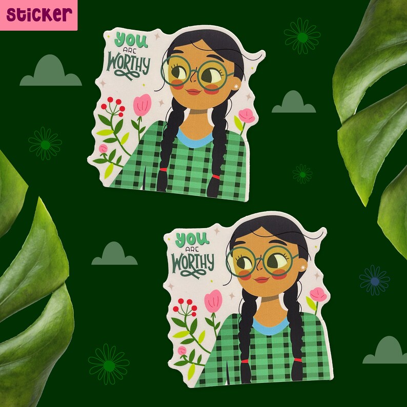 Peut inclure: Deux autocollants avec une illustration de dessin anim&eacute; d'une personne aux longs cheveux noirs portant une chemise &agrave; carreaux vert et blanc. Le texte sur l'autocollant est "You are worthy".