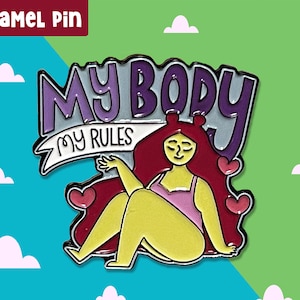 May include: Enamel pin featuring a cartoon woman with red hair sitting with her legs crossed. The pin says "My Body My Rules" in purple and white lettering.