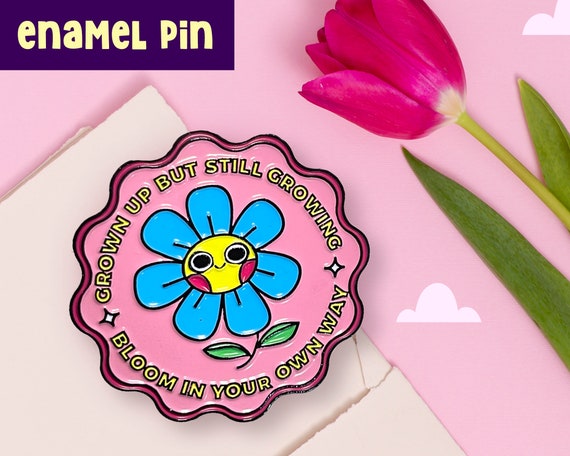 Grown up but still growing enamel pin