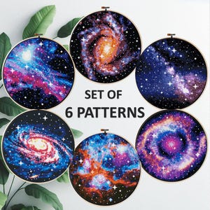 May include: Six embroidery patterns showcasing vibrant galaxy designs, each within a wooden hoop. The image includes the text "SET OF 6 PATTERNS". The hoops are displayed against a white background.