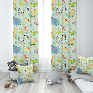 May include: Two green curtains with a jungle animal print. The print features a variety of animals including zebras, giraffes, monkeys, lions, elephants, and turtles. The curtains are hung in a room with a white window frame and a white rug.