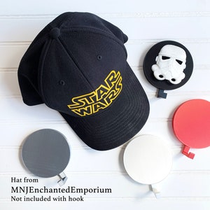 May include: Four different colored hooks with a black baseball cap with the words "Star Wars" in yellow lettering. Hat from MNJEnchantedEmporium. Not included with hook.