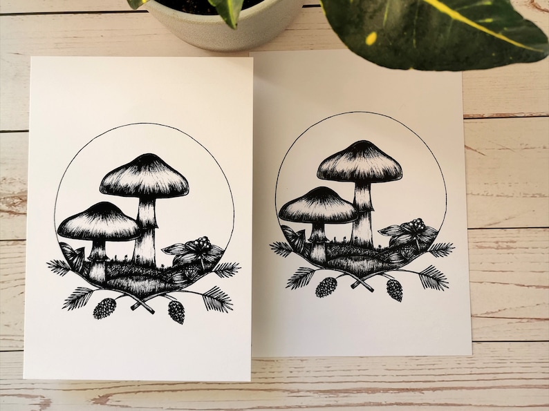 May include: Black and white line art print of three mushrooms in a circle with leaves and berries around them.