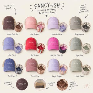 May include: A collection of twelve baseball caps with mesh backs, each featuring the text Fancy-ish embroidered on the front. Each cap is paired with a matching underside showing various patterns including polka dots, stripes, floral, and leopard prints.