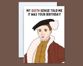 May include: Greeting card with a cartoon illustration of a person in historical attire. The card reads, "MY SIXTH SENSE TOLD ME IT WAS YOUR BIRTHDAY!" The person is wearing a black hat, a gold and brown tunic, and a fur-lined coat.