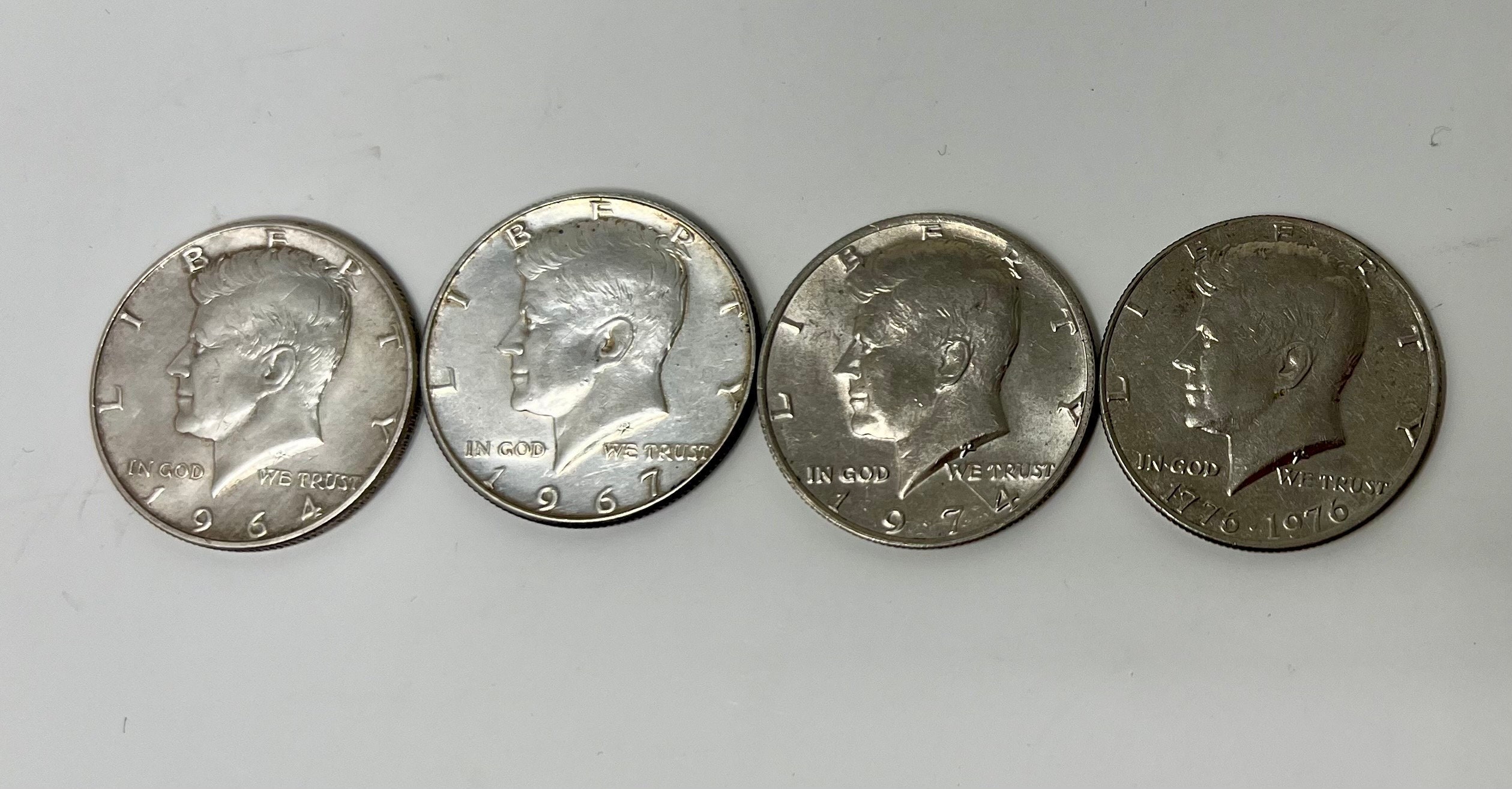 4 KENNEDY HALF DOLLAR 1964-69-1776-1976-1974. very good condition