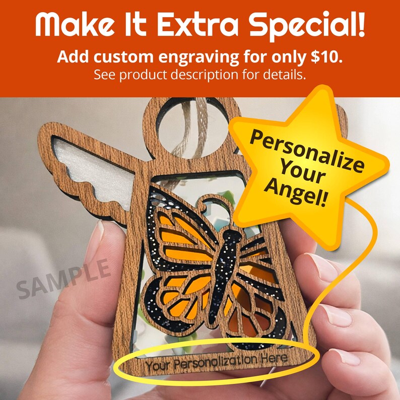 a person's hand holding a wooden angel ornament with a butterfly design. The person is holding the ornament with a star-shaped tag attached to it, which appears to be a personalized decoration.