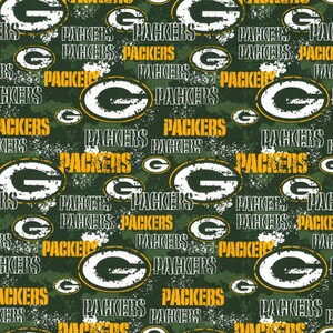 May include: Green and white distressed pattern with the words "Packers" repeated throughout. The pattern also includes a green and white logo with a "G" inside a circle.
