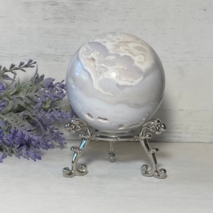 Snow Agate 70mm Sphere smooths dysfunctional energies,  eliminates negativity and clears the aura