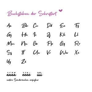 May include: A white background displays a cursive alphabet chart in black ink. The text "Buchstaben der Schriftart" is above the letters, with a purple heart. Additional special characters are shown below the alphabet.