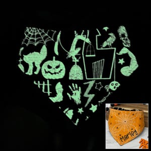 May include: A black Halloween-themed pet bandana with a glow-in-the-dark design. The design includes a cat, jack-o'-lantern, spider web, haunted house, and other spooky elements. The bandana is orange with a white spider web design and the name "Marley".
