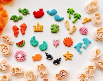May include: A set of 30 colorful plastic cookie cutters shaped like various summer and beach-themed objects, including seashells, starfish, palm trees, flip-flops, ice cream cones, and more.