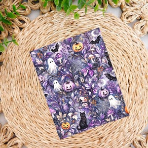 May include: A rectangular print featuring a dark purple and black botanical pattern with illustrations of white ghosts, orange jack-o'-lanterns, black cats, bats, spiderwebs, mushrooms, and small glass potion bottles scattered throughout the design.