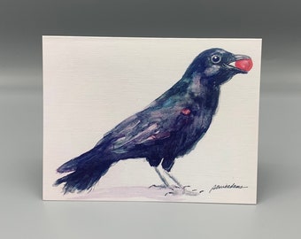 May include: Watercolor painting of a black crow holding a red berry in its beak. The crow is standing on a white background.