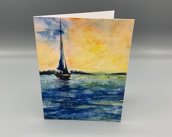 May include: A watercolor painting of a sailboat on a body of water with a yellow and orange sunset in the background.