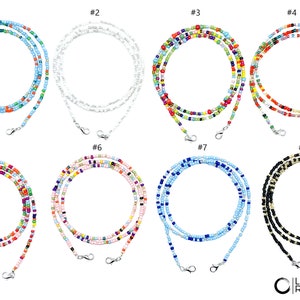 May include: Eight different styles of beaded mask chains, each with a different color combination. The chains are made of small, colorful beads and have silver clasps at each end.