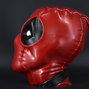 May include: A red and black Deadpool mask with a glossy finish. The mask is made of a durable material and features a detailed design.
